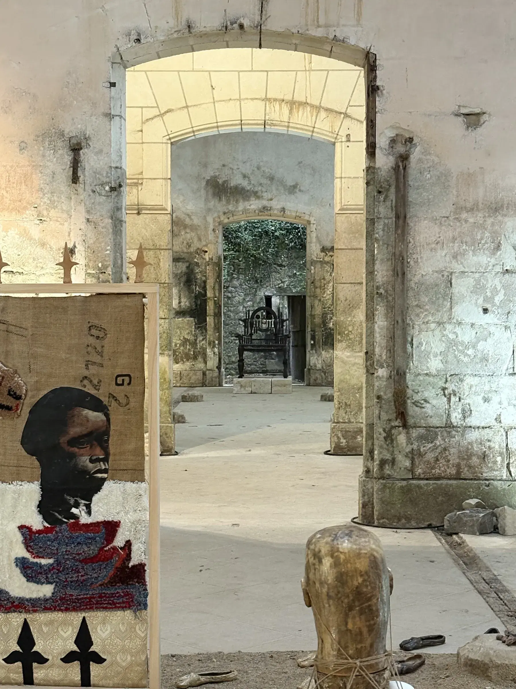 View through a sequence of stone doorways, with Chada’s installation in the foreground.