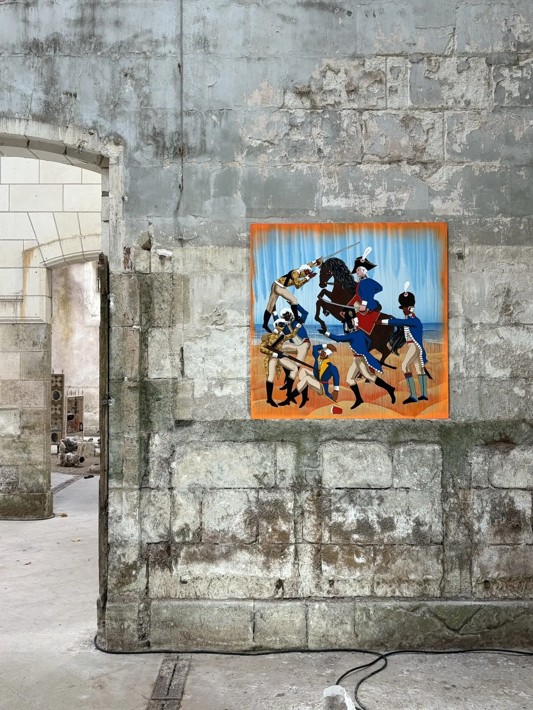 Wide installation view of a figurative painting within the architecture of the exhibition.