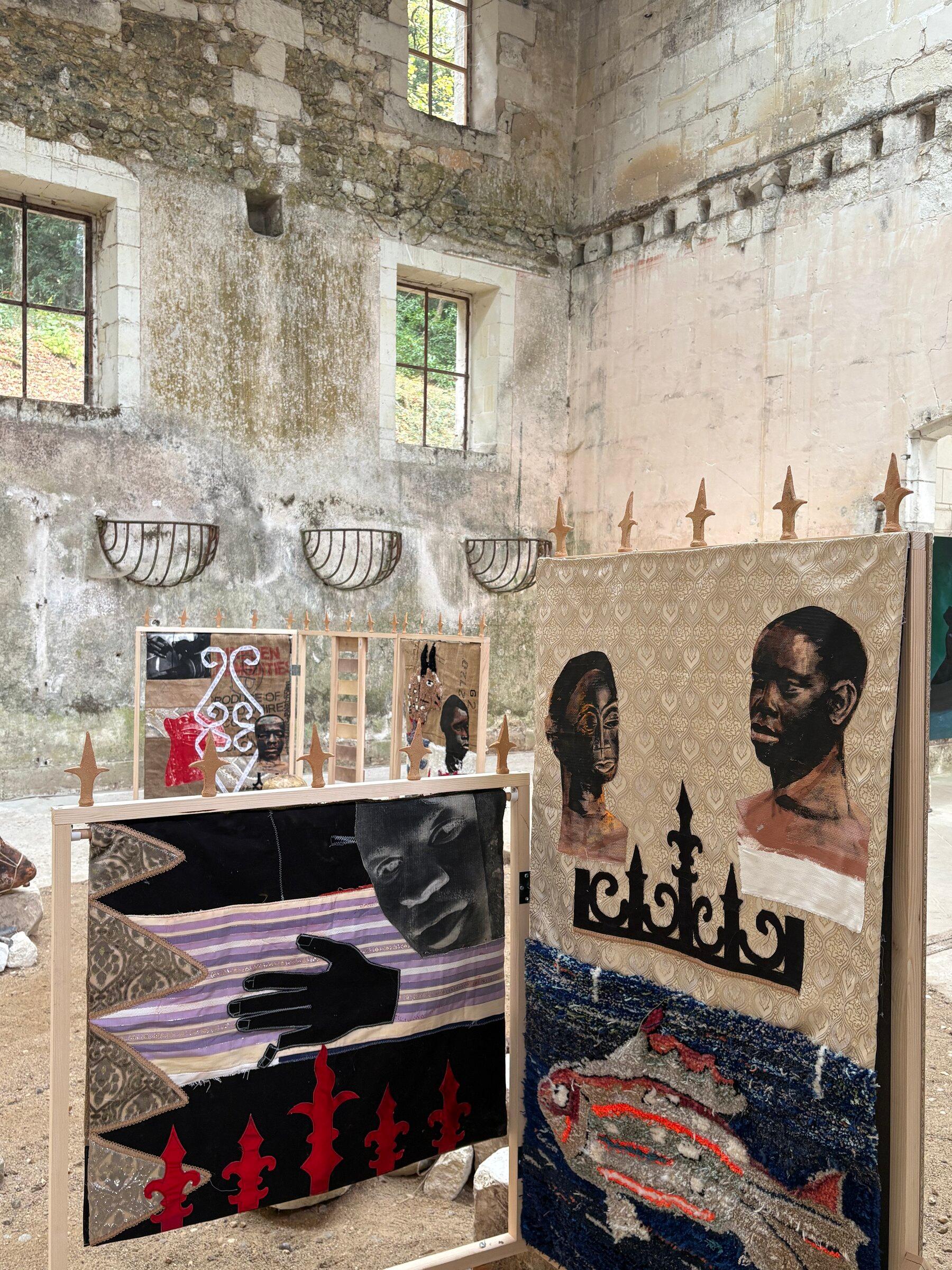 Works by contemporary African artists installed in dialogue with stone walls and architectural fragments.